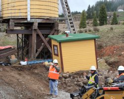 At Los Pinos tank, the construction crew takes a break to watch us pass. They're doing some heavy maintenance on the tank, replacing rotted foundations with new concrete and timber.
