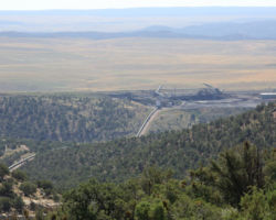 Looking down the conveyor towards one of the coal piles.   There's another conveyor going miles off to the left that goes to another part of the mine.  It would appear that coal is hauled down here from the coal seam faces, where it's then loaded onto the conveyor for the trip over the hill.