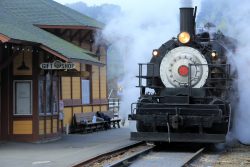 CVL #4 pulls up beside the depot in the morning fog. The sun is up, but hasn't burned through the mist yet.