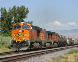 BNSF 7682, a shiny new GEVO, pulls a BNSF manifest through Mack, past the local