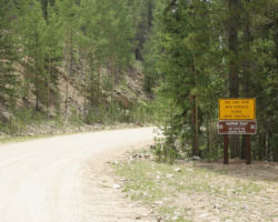 They're not kidding - really the sign should have read "*Appallingly Rough* Narrow One Lane Road"
