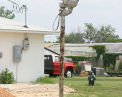 An unusual US&S teardrop bell at an unprotected crossing in Purdy