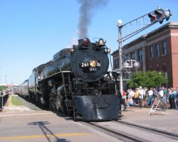 Having loaded up the passengers, 261 pulls east/north away from the ex-DRI&NW depot (the brick building on the right)
