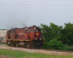 Just before the sun fades below the horizon, AM 68 and a fresh crew start the turn out of the yard and back onto home rails south towards Springdale