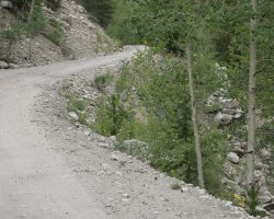 Past Midway Tank, we see one of the DSP&P's famous fitted-stone retaining walls. Unlike the ones up on the Palisades, this one has collapsed, forcing the new road to detour around the fill.