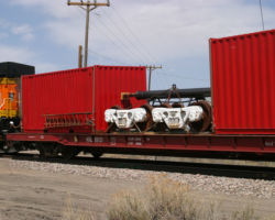 Trailing behind the locomotive is a KRL flat with spare parts for the behemoth.