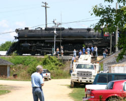 Anybody need a railfan? 261 backs past the drawbridge control signal at Sabula