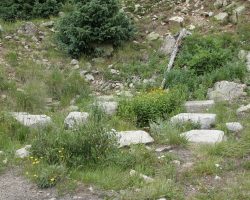 This is the base of the original Woodstock water tank. It was built with the line in 1881, and destroyed only three years later. On 10-Mar-1884, an avalanche ripped through the townsite, destroying the town, the tank, and killing 13. The site was abandoned, with a new replacement tank being built down at Tunnel Gulch, where it is today.