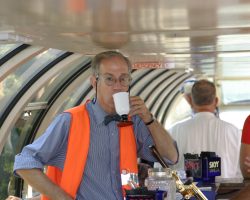 As we roll along through eastern Iowa, Mr. Posner pauses from his duties to enjoy a cup of coffee. Henry Posner III is the chairman of RDC, the parent company of IAIS and owner of the two steamers. (DJH Photo)