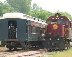Backing past the train. Note the small camera mounted under the visor on the conductor's side.