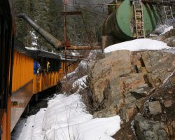 At Tank Creek, we stop briefly to take on water. The original wooden tank is long gone, replaced by this former tank car in 1966.