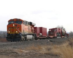 Trailing about five minutes behind is the special... Behind it you can see another hyrail. The one in front checks for obstructions or other problems, and the one behind checks for any lineside damage or broken rails the heavy move may have caused.