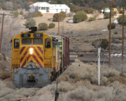 With the clouds rolling in, SFS 93 starts the climb out of Lamy through the wye