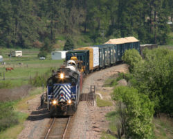 Finally done switching, the local comes down to the St. Regis siding to run around their train.