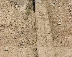 Granite gives us the most compelling evidence - not only a cleaned-out flangeway, but fresh tire tracks in the dirt. That proves it was a hyrail-type vehicle