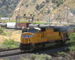 After sitting crewless for nearly three hours, 4860 heads west at Utah Railway Junction