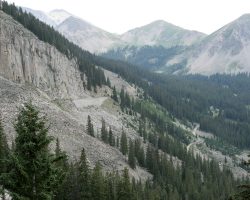 A look back up at the upper Middle Quartz Creek valley, including the Palisades wall on the left and the grade past Woodstock and the Sherrod Loop off to the right.