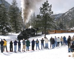 A typical photo line forms at McCausland's Bridge to watch 473 blast by. The namesake (scary) footbridge can barely be seen in the background.