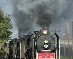 Right on time, the triple-header pulls towards the main Rock Island yard and the connection with the IAIS mainline.