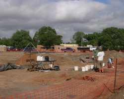 At the end of May, there's some serious archeology going on here. The area is scheduled to be dug up to build underground parking as part of the Santa Fe Railyards redevelopment.