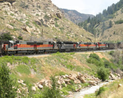 Six mid-train pushers help shove this one over the hill