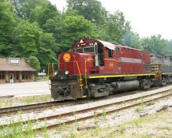 44 eases over the Winslow grade crossing with the first half of the train