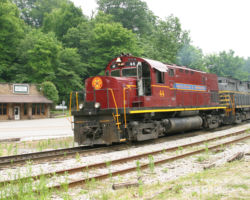 44 eases over the Winslow grade crossing with the first half of the train