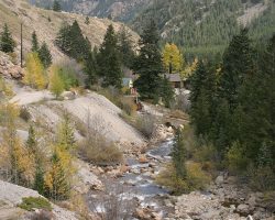 Looking east off the deck truss bridge, we look down Clear Creek towards the Lebanon Mine (now open for tourists)