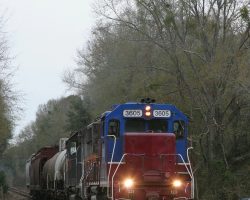 The train is only making about 10-15mph on its trip south. I would imagine that the rather poor condition of much of the track on this particular branch has something to do with this. This is looking down the tree tunnel at Flint, about halfway between Baconton and Camilla.