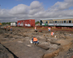 A bit east of the enginehouse, they're digging up something else. I think this was the remaints of the first ATSF depot, turned freight house