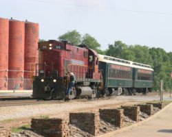 About twenty minutes behind, the returning Van Buren-Springdale passenger train, complete with 56 running long hood first