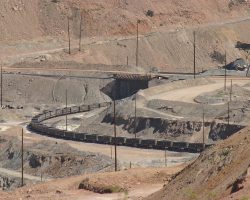 The OT-2 pulls in under the concentrator to load nearly 6,000 tons of copper sulfide ore