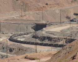 The OT-2 pulls in under the concentrator to load nearly 6,000 tons of copper sulfide ore