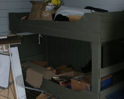Bunks on the south wall of the room immediately behind the main office
