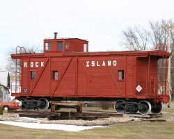 And the presumably Rock Island wood side caboose out front. The West Liberty diamond (cut out of the track) and a speeder trailer sit in front.