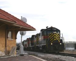 IAIS 413 passes the West Liberty depot and control signal (non-functional) on a cold 26-Dec-2003.