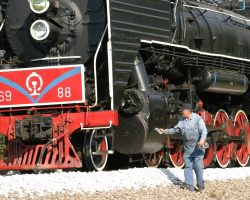 While stopped, one of the crew gives 6988 a quick check with an infrared thermometer to assure none of the bearings are overheating.