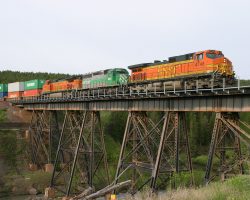 Exiting the park and entering the Blackfeet Indian Reservation, the eastbound crosses Midvale Creek Bridge in East Glacier.