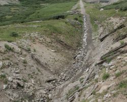From on the side of the cut, very near the portal face, looking back down the valley towards the station (just around the hill on the right)