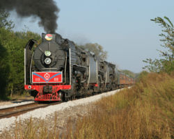Charging along at track speed just outside Green Rock, to the east of Colona.