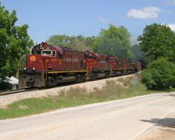 At Garfield, AR, 68 and train round the curve and blast the horns for the Hwy 127 crossing.