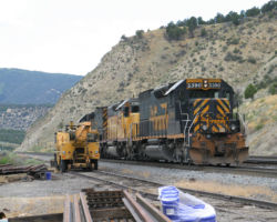Coasting downhill past the house track and a few stored materials