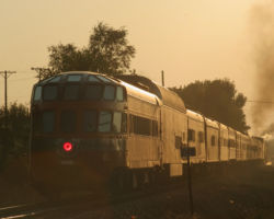 Final frame - the train passes off into the evening sun in Moline, with Cedar Rapids and its oscillating red Mars light bringing up the rear.