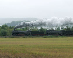 Just north of Muscatine, the two take off though the rain on the IC&E back to Davenport (DJH Photo)