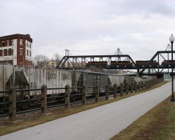 On the Arsenal side, the bridge crosses Lock & Dam 15. On the Davenport side, it crosses over the bike trail, River Drive, and the IC&E main (all of which are significantly below the river level).