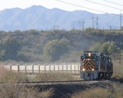 Even in the winter, it's hot in Hayden. The loaded ore train pulls around the corner towards the dumper