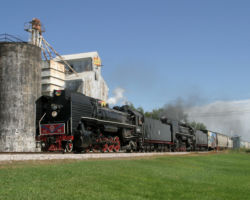 One last look - the famous Atalissa, IA shot. The two will continue to Iowa City, where they'll drop the freight and run light (with their tool car) out to Newton. Once there, the fires will be dropped and the units stored, awaiting their sale or another excursion. (DJH Photo)