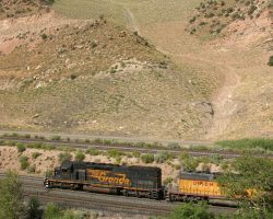 From high above the line further down towards the power plant, we see 5371 through a break in the trees