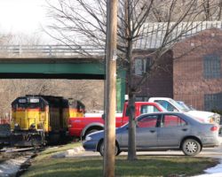 This is the Iowa City yard, with the IAIS offices off to the right and LLPX 2039 and 2040 stored under the Dodge Street overpass.