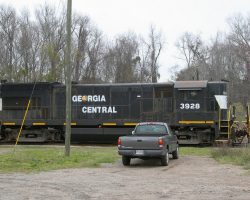 After finishing assembly of this train, the crew took it up as far as the end of yard limits, just east of Dean Forest Hwy (I-16 exist 160), and parked it. Too bad I'd set up for my first shot just beyond that, and got skunked.